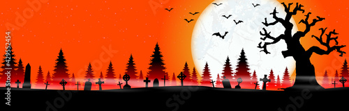 halloween cemetery in front of woodlands with full moon