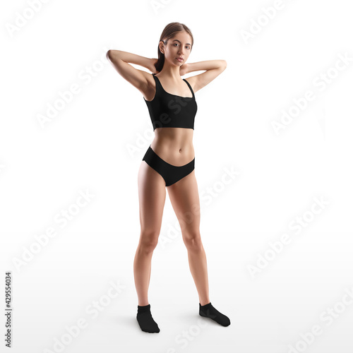 Mockup of black underwear, top and panties on the body of a young girl in socks, isolated on the background