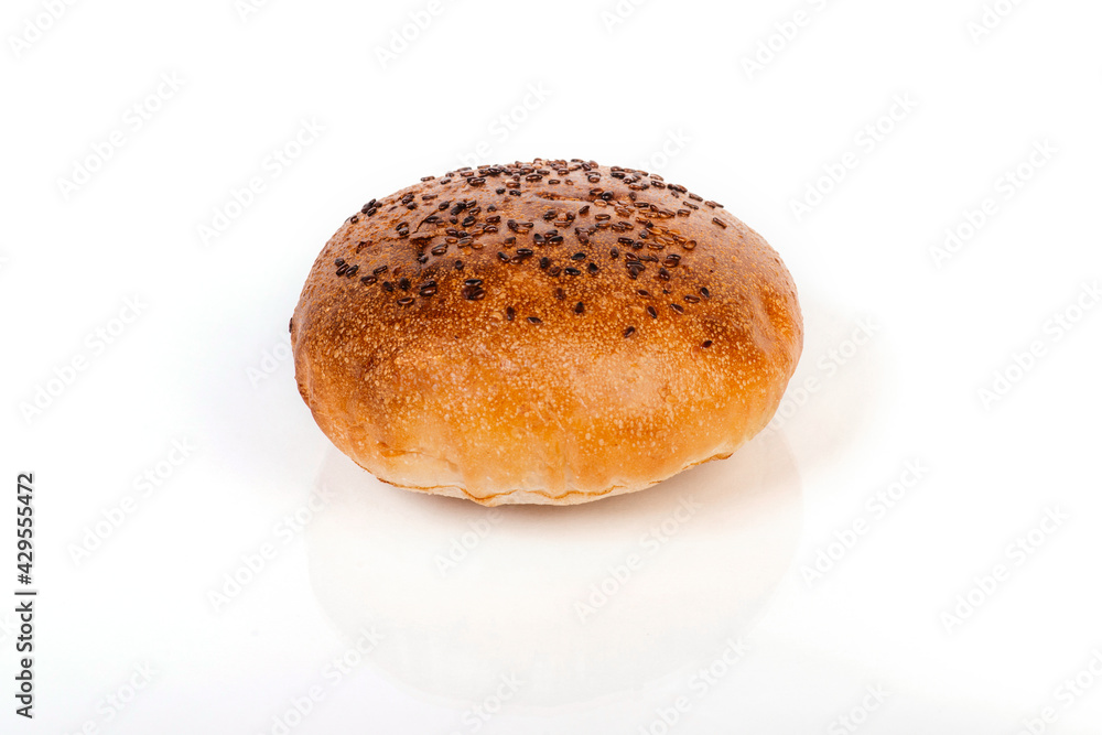 One bun with sesame isolated on white background One bun with sesame isolated on white background