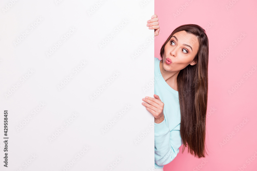 Photo of beautiful brunette amazed young woman present news novelty empty space board isolated on pastel pink color background Photo of beautiful brunette amazed young woman present news novelty empty space board isolated on pastel pink color background