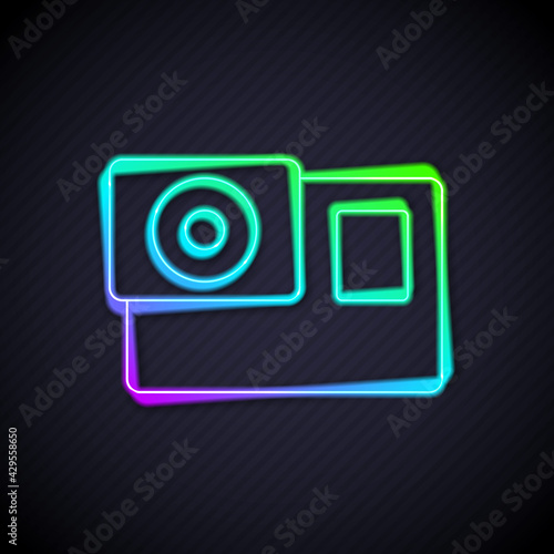 Glowing neon line Action extreme camera icon isolated on black background. Video camera equipment for filming extreme sports. Vector