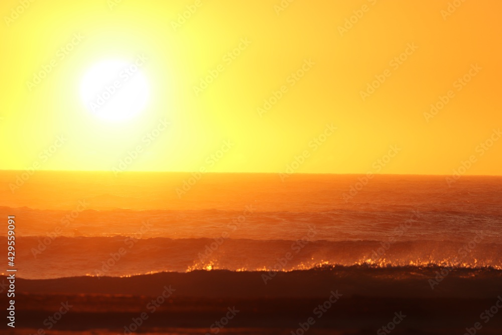 Sunset over the agitated ocean, on the skeleton coast in southern Namibia.