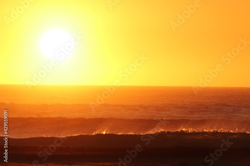 Sunset over the agitated ocean  on the skeleton coast in southern Namibia.