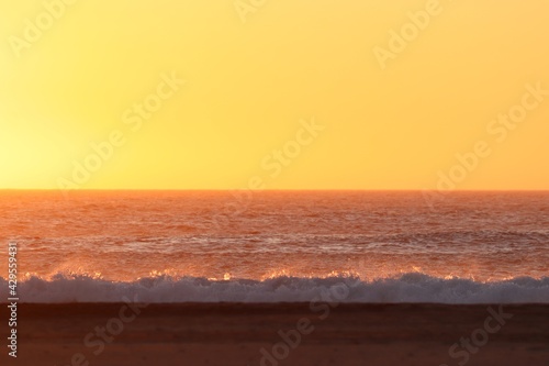 Sunset over the agitated ocean, on the skeleton coast in southern Namibia.