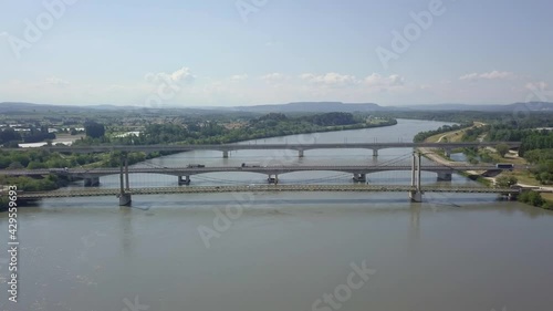 Suspension Bridge Pont De Roquemaure, Rhone Road Bridge And Railway Viaduc De Roquemaure, Rhone River, Aerial Descending photo