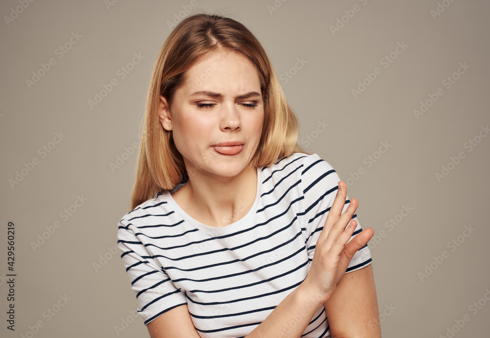 Upset woman model disgust emotions beige background portrait Upset woman model disgust emotions beige background portrait