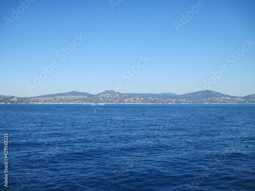 Scenic panoramic landscape of the town of the sea country in the morning. Beautiful view of the sea and mountains. Seascape with coast of island. Skyline view from yacht in the sea.
