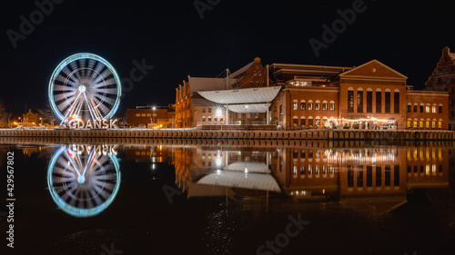 Winter cityscape of Gdansk at dusk with ferris wheel, Poland