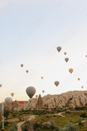 Wonderful hot air balloons flying over Cappadocia rocks in Turkey. photo