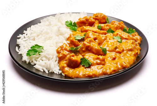 Plate of Traditional Chicken Curry and rice isolated on white background with clipping path embedded