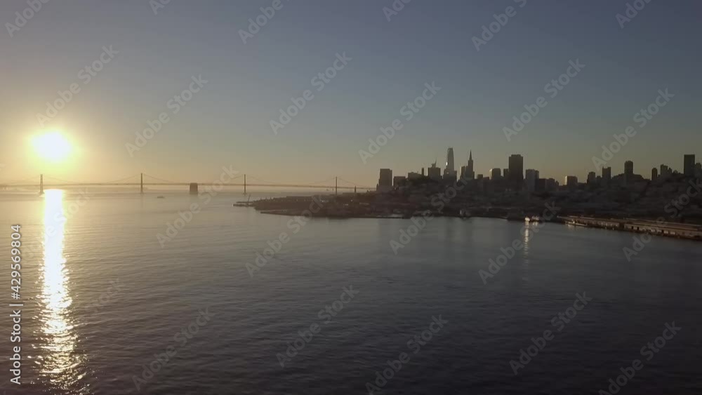 Coastal View Of Cityscape and Skyscrapers In Sunset - Aerial shot Coastal View Of Cityscape and Skyscrapers In Sunset - Aerial shot
