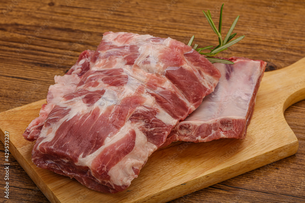 Raw pork ribs served rosemary Raw pork ribs served rosemary