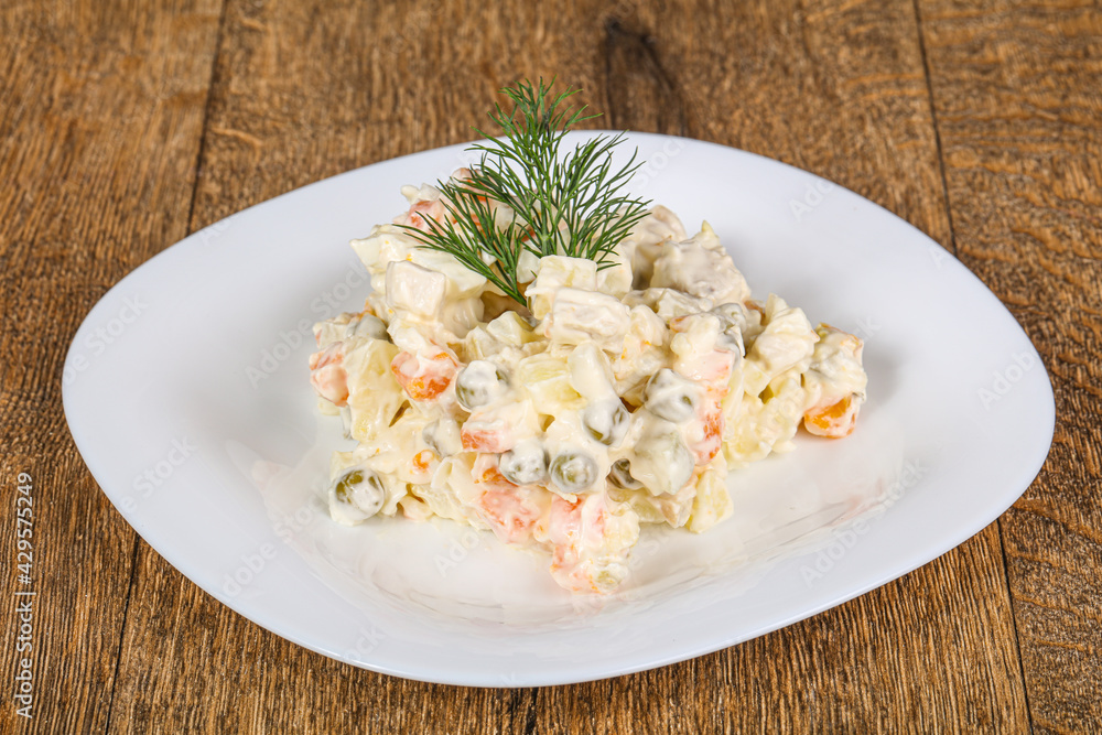 Traditional Russian salad with mayonnaise Traditional Russian salad with mayonnaise