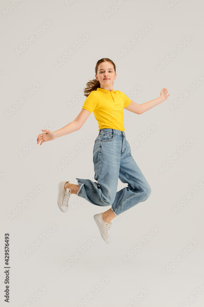 Caucasian girl isolated on white studio background. Copyspace. Childhood, education, emotions concept Caucasian girl isolated on white studio background. Copyspace. Childhood, education, emotions concept