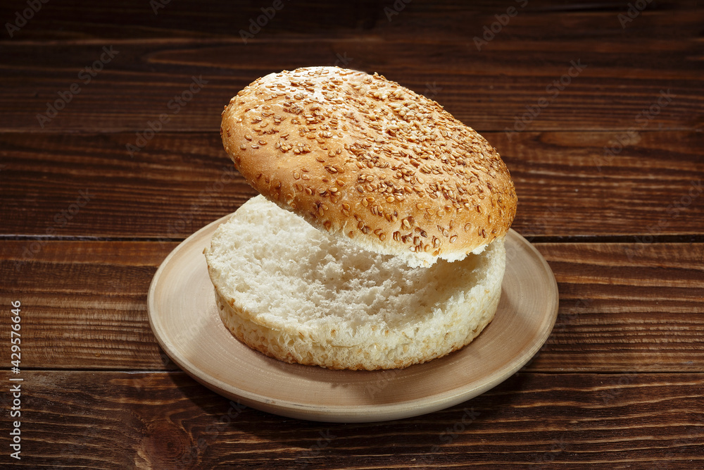 Burger bun on wooden background Burger bun on wooden background
