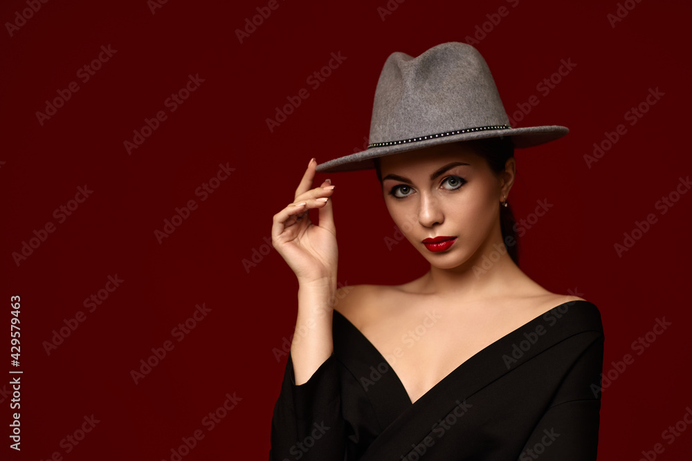 portrait of fashionable beautiful girl on red bakground. portrait of fashionable beautiful girl on red bakground.