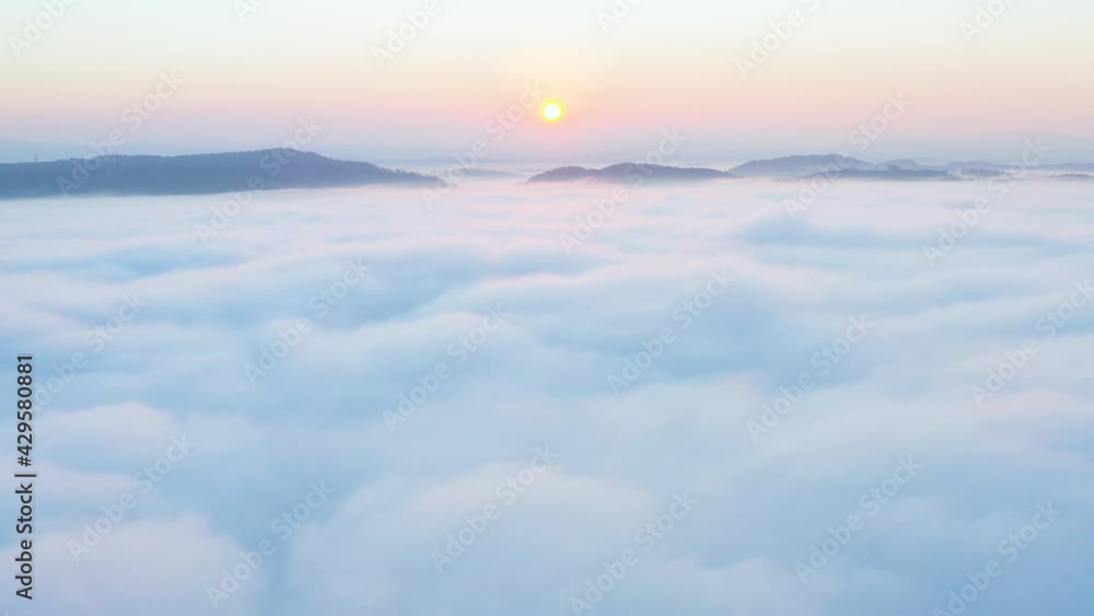Aerial view flying in the clouds at sunset. Gold colored sunset cloudiness in high contrast. Real sky. The concept of dreams and weather forecast. Los Angeles during sunrise in beautiful summer day. Aerial view flying in the clouds at sunset. Gold colored sunset cloudiness in high contrast. Real sky. The concept of dreams and weather forecast. Los Angeles during sunrise in beautiful summer day.