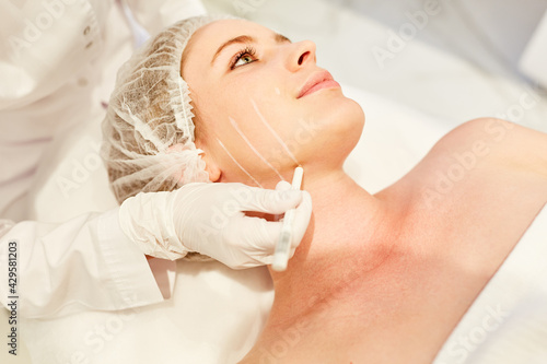 Preparation for plastic surgery on a woman's face