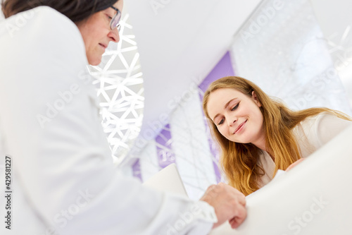 Young woman at the reception counter in cosmetic studio