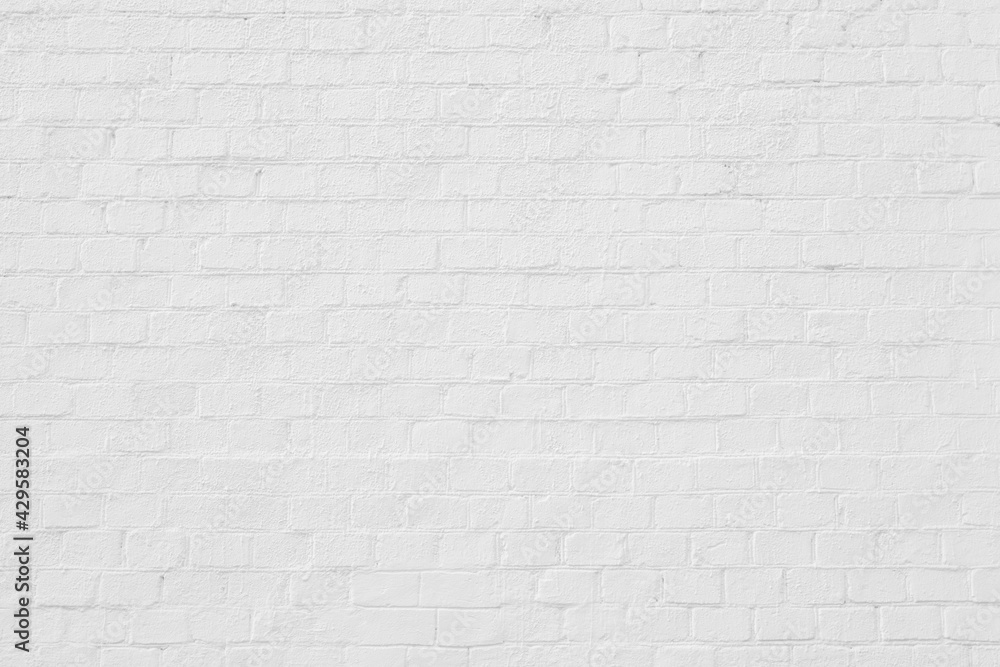 White brick building wall. Interior of a modern loft. Background for design White brick building wall. Interior of a modern loft. Background for design
