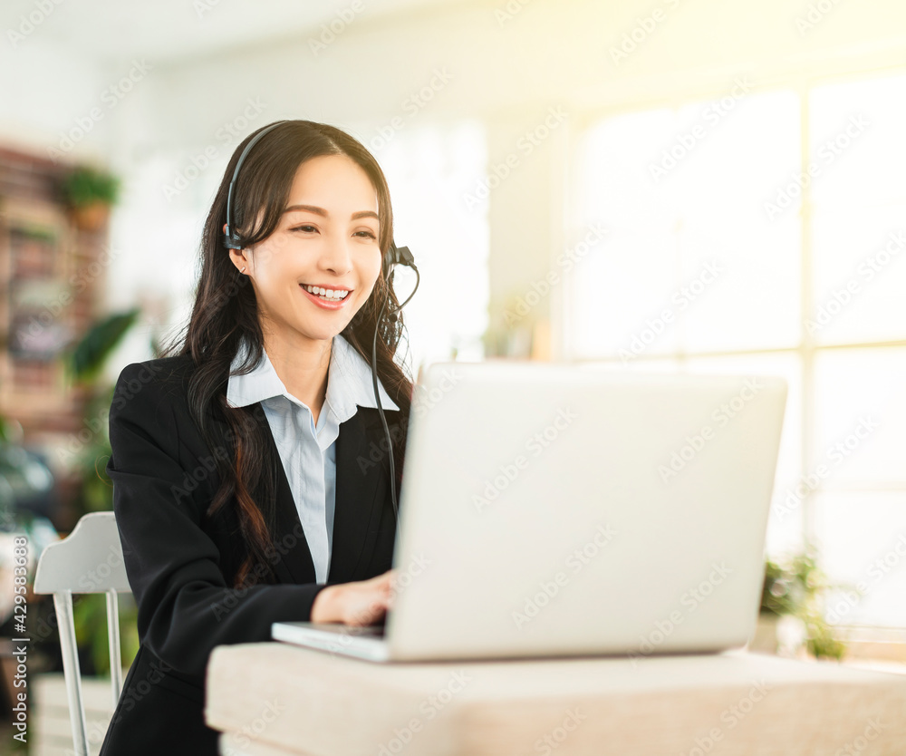 Business woman in headphone and working in home office Business woman in headphone and working in home office