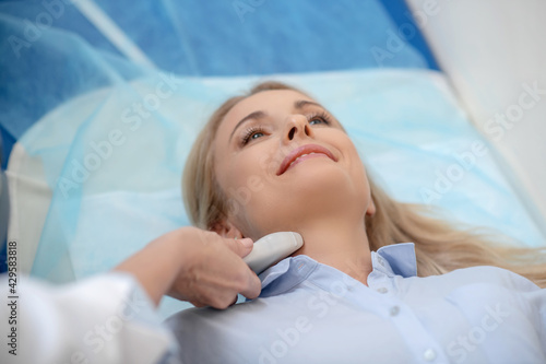 Принти на полотні Woman during ultrasound examination of the neck