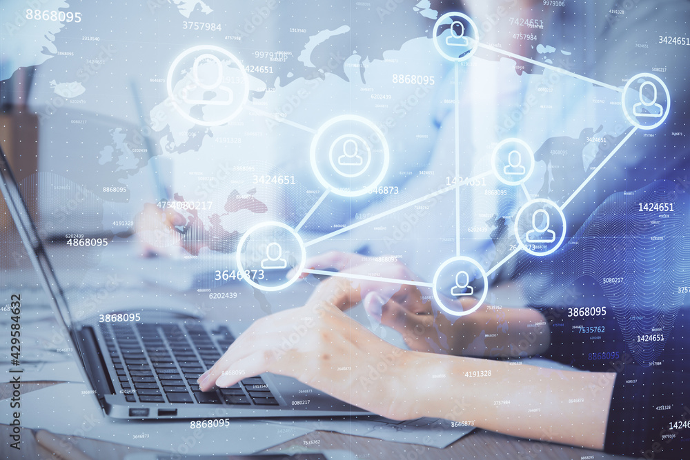 Double exposure of woman hands typing on computer and social network theme hologram drawing. People media concept.