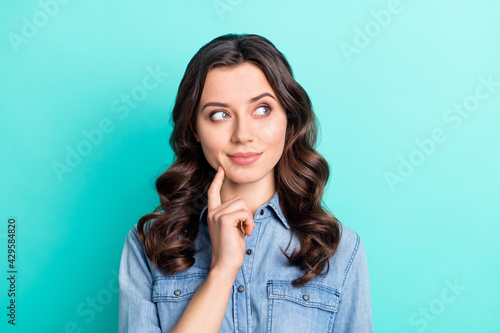 Принти на полотні Photo of funny tricky young woman wear jeans shirt finger cheek looking empty sp