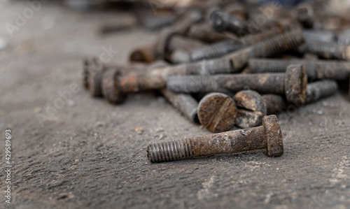 background construction.iron bolts scattered on the ground.