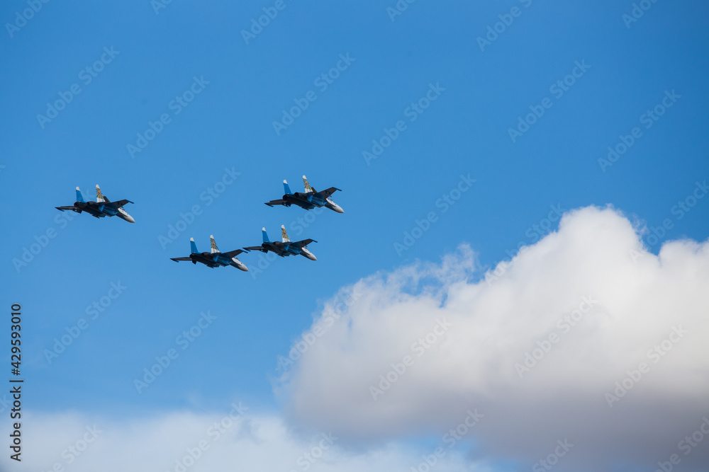 military aircraft fly at low altitude over the audience during the air show. patriotic military holiday. demonstration performance of professional pilots at the airshow military aircraft fly at low altitude over the audience during the air show. patriotic military holiday. demonstration performance of professional pilots at the airshow