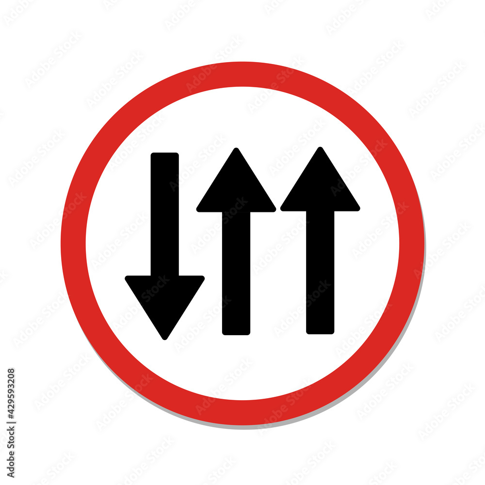 Red traffic sign of road conditions will change ahead to two lanes of oncoming traffic. Three lane traffic road. Red traffic sign of road conditions will change ahead to two lanes of oncoming traffic. Three lane traffic road.
