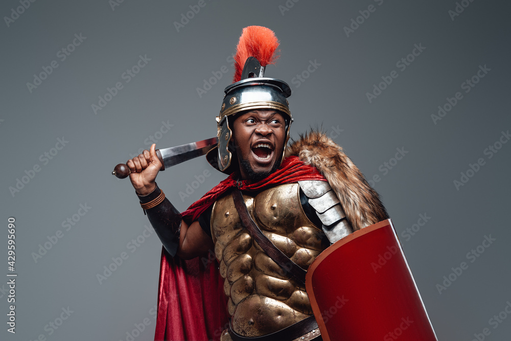 Naklejka premium Violent roman warrior in fight pose with sword