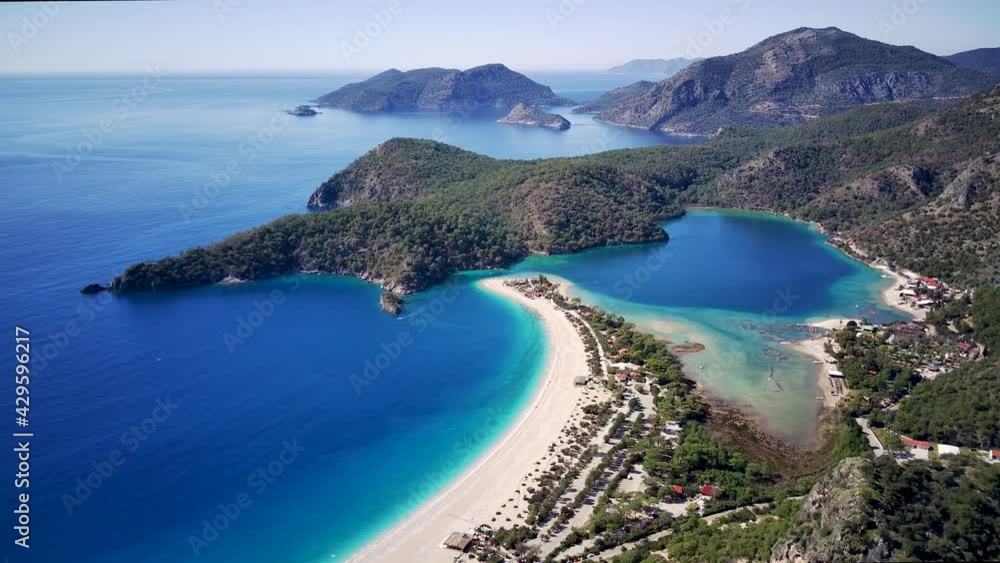 Amazing beautiful panoramic view from drone of natural park of Oludeniz and Fethiye blue lagoon and tranquil aquamarine dead sea.
Amazing beautiful panoramic view from drone of natural park of Oludeniz and Fethiye blue lagoon and tranquil aquamarine dead sea.