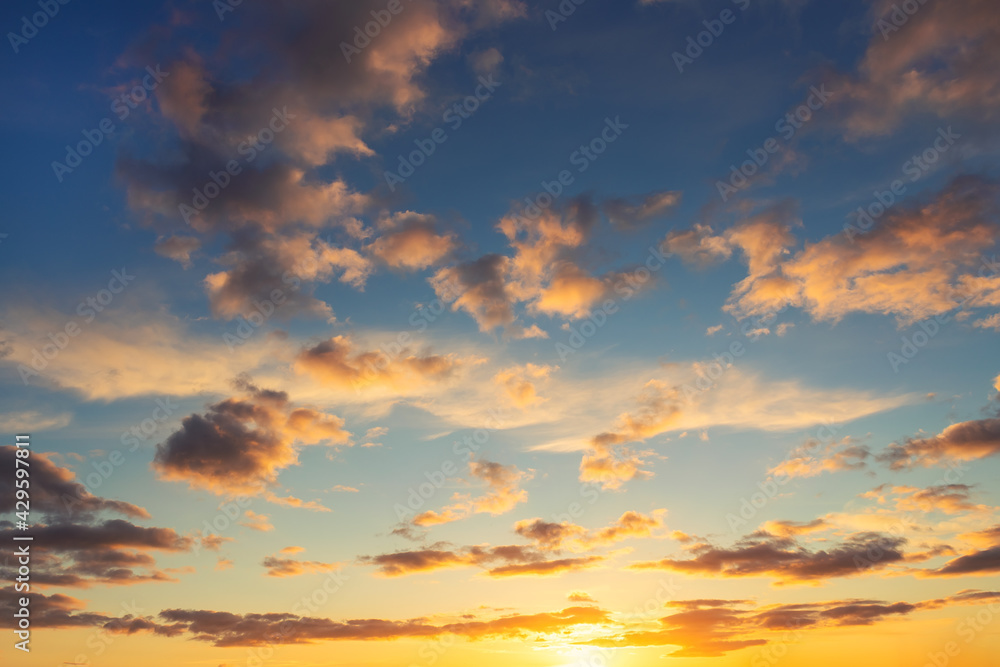 Dramatic colorful red orange dark blue sunset or sunrise sky evening morning landscape clouds. Natural beautiful cloudscape dawn background wallpaper. Stormy windy nature twilight dusk scene panorama