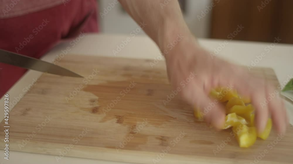 Line cook slicing beautiful pieces of yellow bell pepper Line cook slicing beautiful pieces of yellow bell pepper