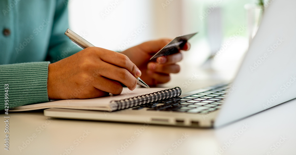 Close up woman hand using credit card and smartphone laptop for buying online shopping Close up woman hand using credit card and smartphone laptop for buying online shopping