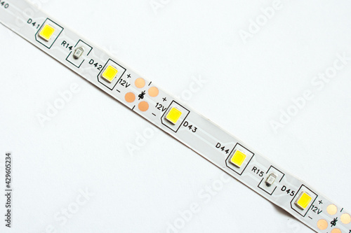 Wallpaper Mural Led strip tape isolated on white background. Diode as a component for home made lighting. Diy and save energy concept. Torontodigital.ca