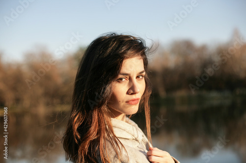Portrait of a beautiful young woman in nature.