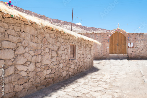 Fototapeta Naklejka Na Ścianę i Meble -  A view of a street of Caspana, a little village in the Atacama desert in northern Chile.