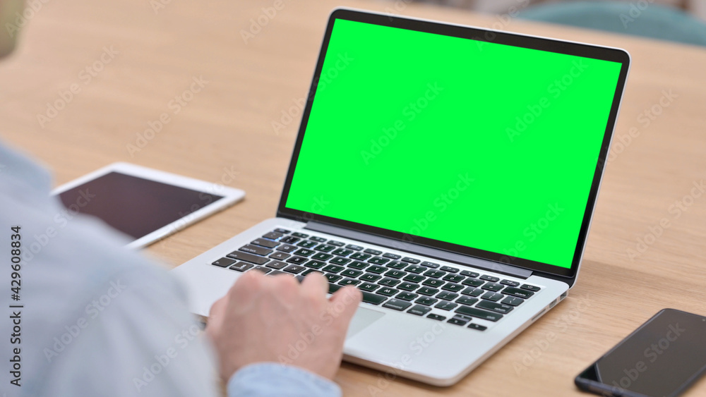 Man Working on Laptop with Green Chroma Key Screen Man Working on Laptop with Green Chroma Key Screen