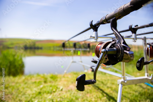 Selective focus on professional fishing gear at a lake in action. 