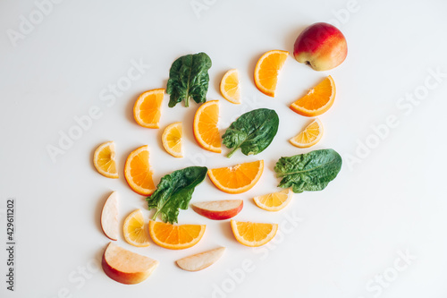 spinach, orange, lemon on the table