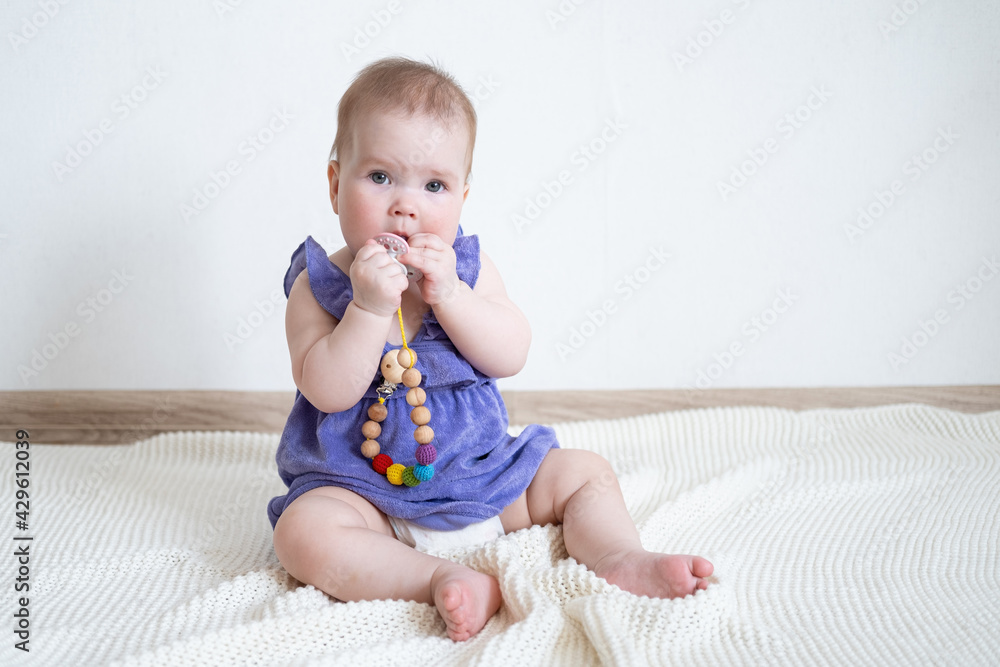 Little cute Baby girl chewing teething beads and nipple Little cute Baby girl chewing teething beads and nipple