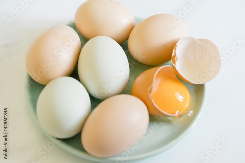 Fresh colorful eggs on a plate