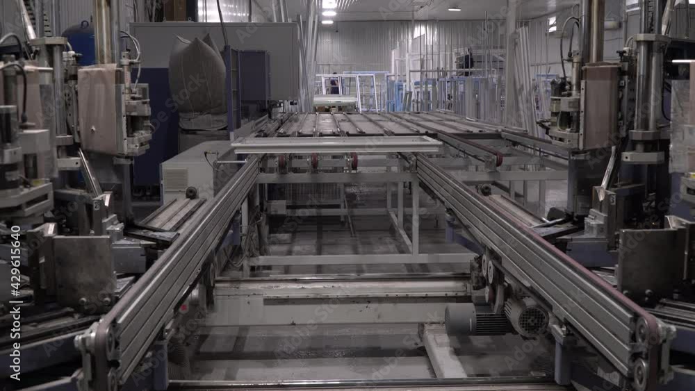 Automatic line at the factory for the production of plastic windows. Automatic line at the factory for the production of plastic windows.