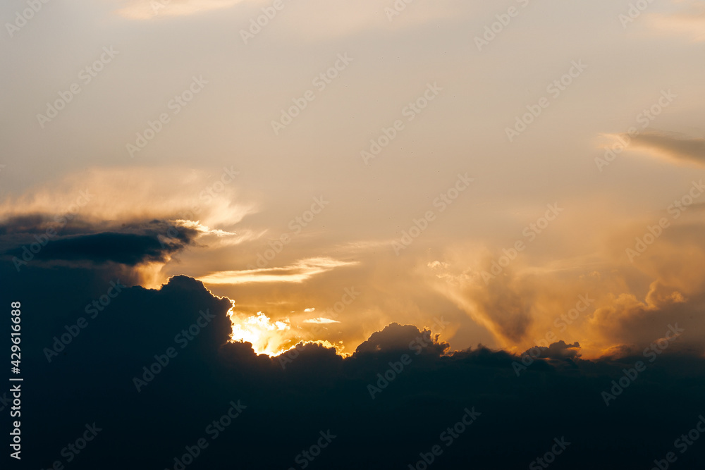 Beautiful dramatic sunset sky with orange and blue colored clouds. Beautiful dramatic sunset sky with orange and blue colored clouds.