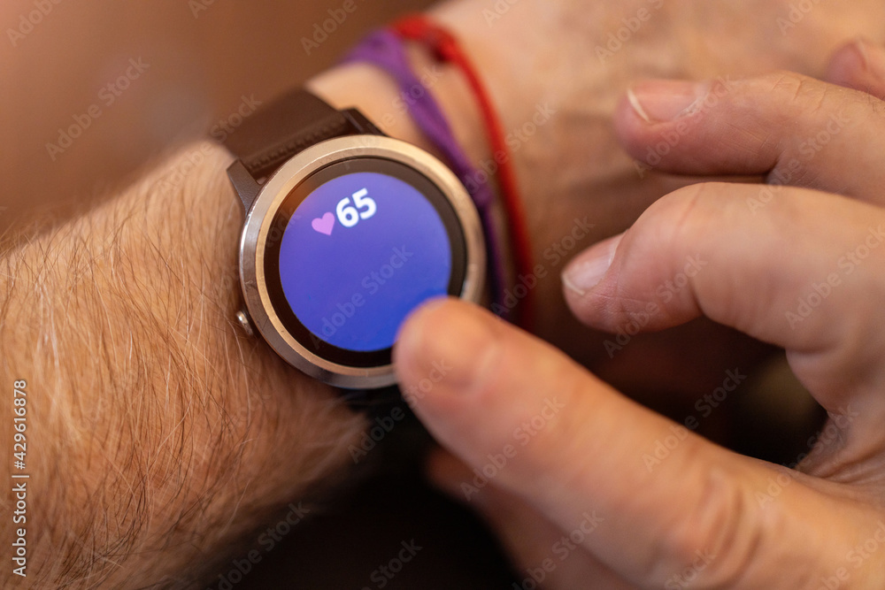 Fototapeta premium Elderly man hand and detail of the smartwatch 