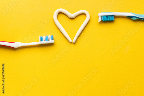 Teeth hygiene concept. Toothbrushes with toothpaste, top view