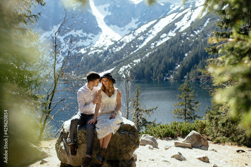 Young couple has a love story in the mountains.