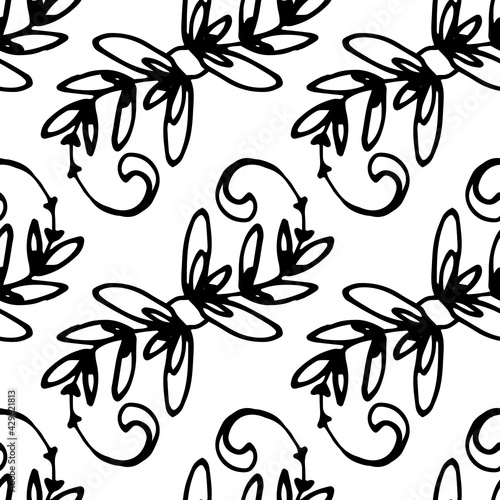 Fotografie A pattern of twigs with leaves and curls